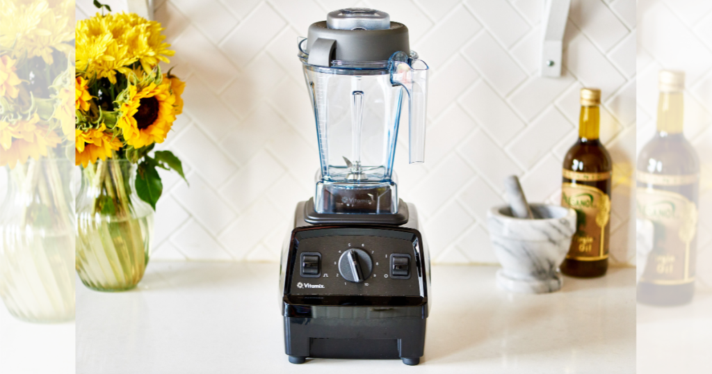 Vitamix blender on counter with sunflowers