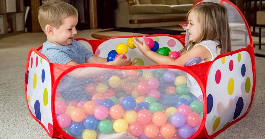 two kids in a ball pit 