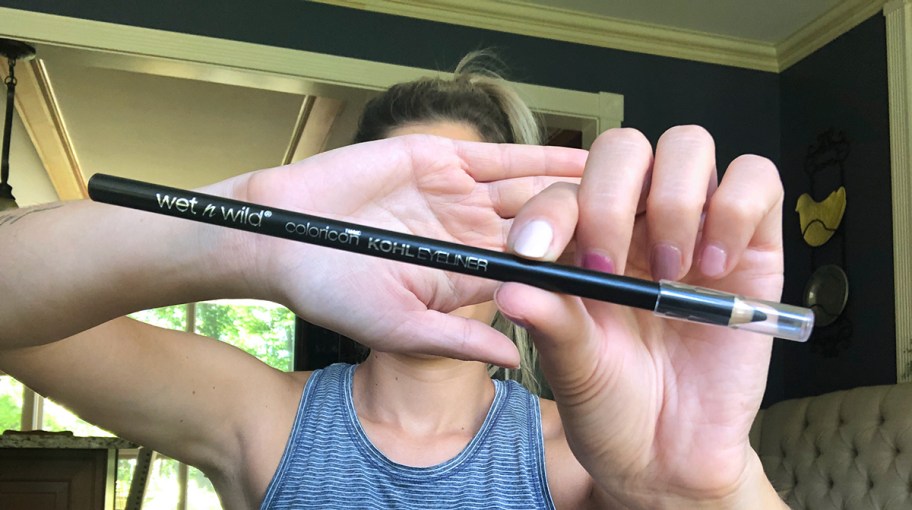 emily holding up wet n wild eyeliner