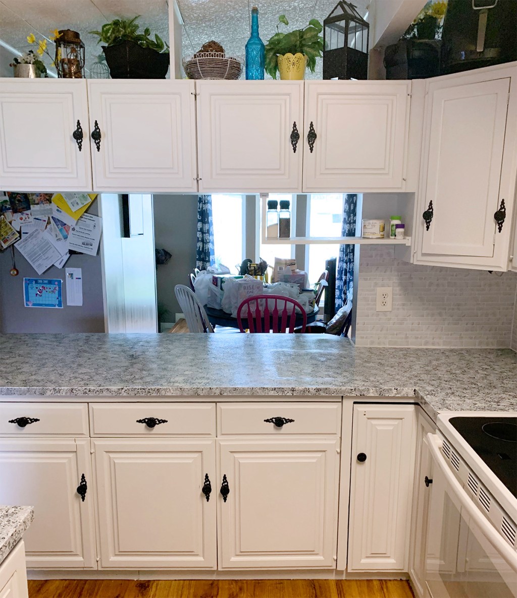 ktichen transformation after with white cabinets and refinished countertop