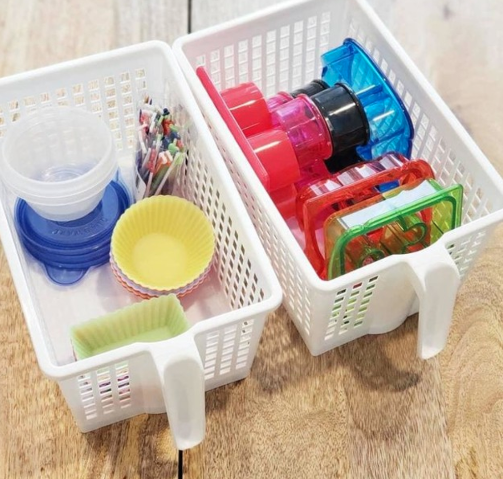 white storage baskets filled with items on counter