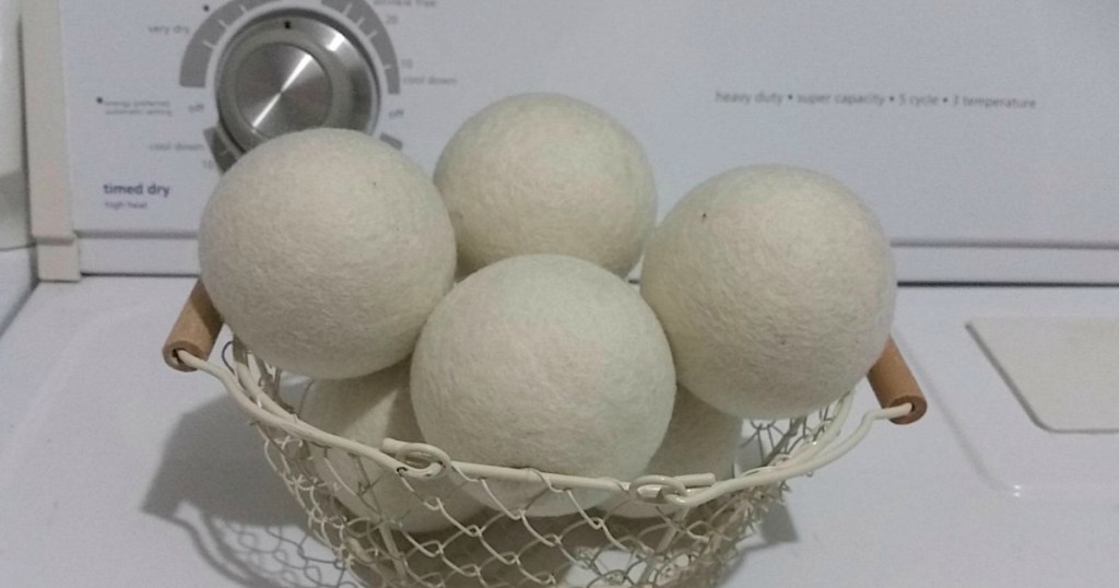 wool dryer balls in bowl on washing machine 