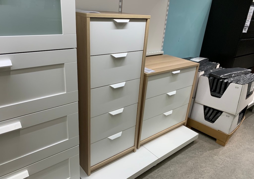 white and tan chest of drawers in IKEA store