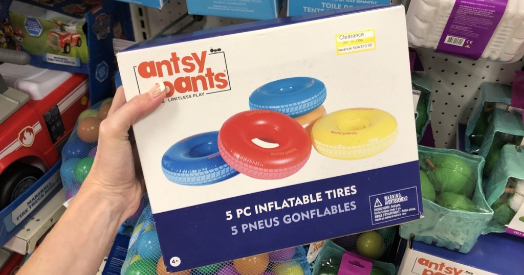 hand holding up atsy pants inflatable tires