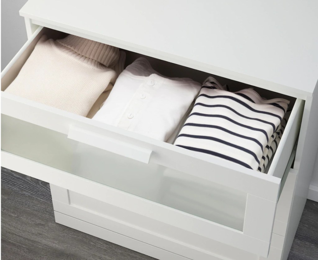 clothes in top drawer of dresser