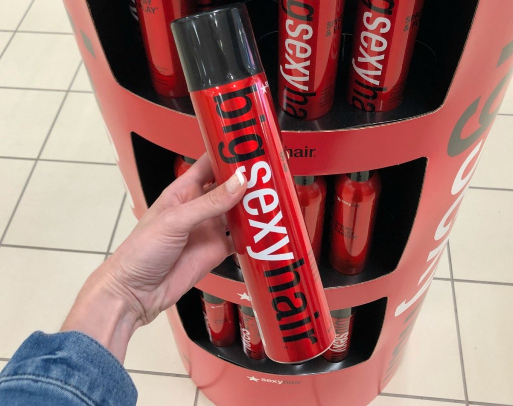 Big Sexy Hair Hairspray in hand in store near display