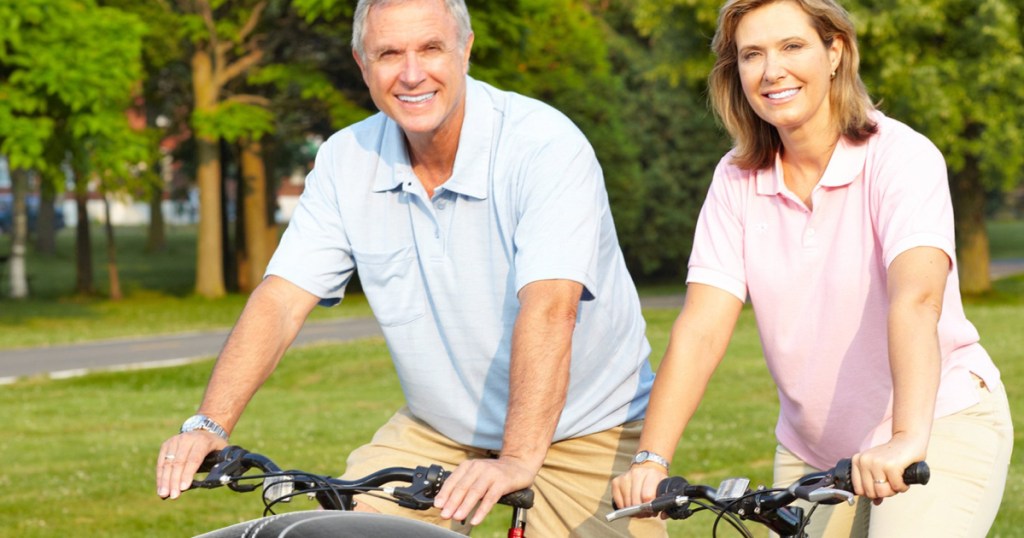 Man and woman riding bikes together Bikeroo