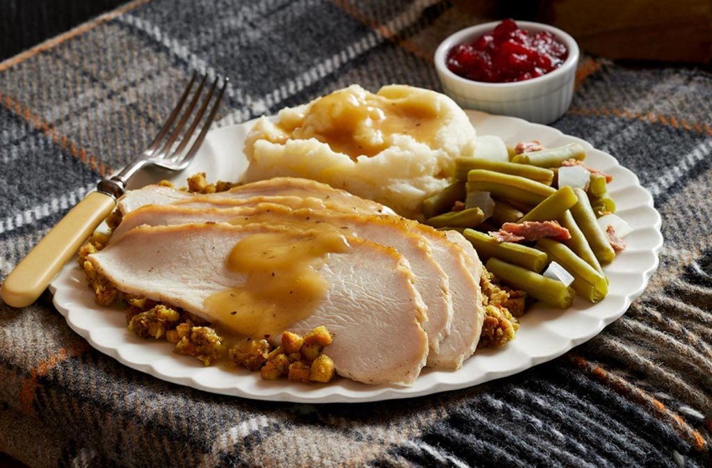 Thanksgiving dinner plate of turkey green beans mashed potatoes