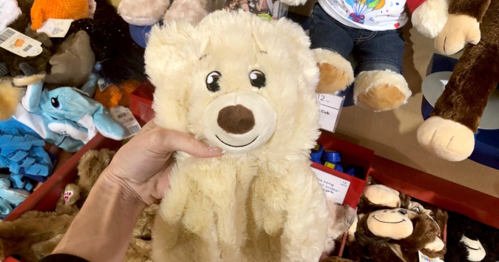 Woman holding unstuffed Build-A-Bear Workshop bear