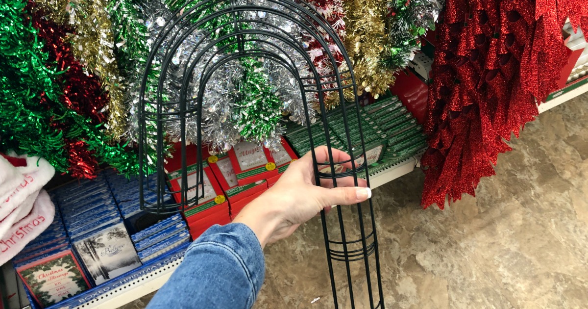 hand holding Candy Cane Wreath