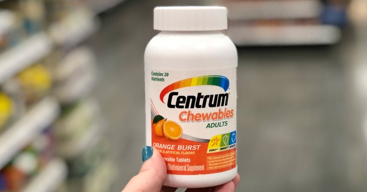 Centrum Chewables held up by hand in Target Aisle
