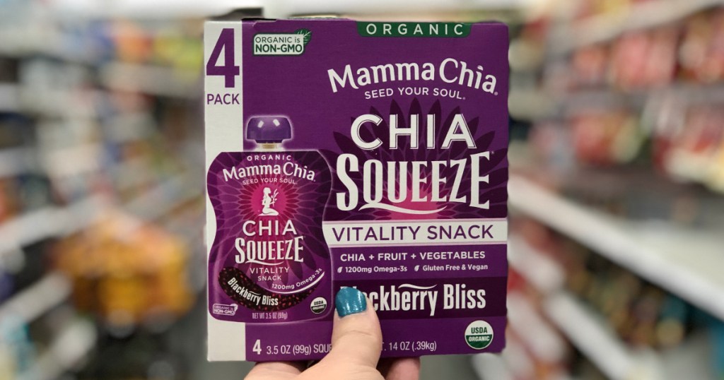 hand holding up box of chia squeeze pouches