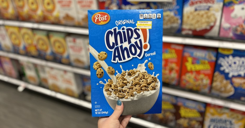 hand holding up box of chips ahoy cereal at target
