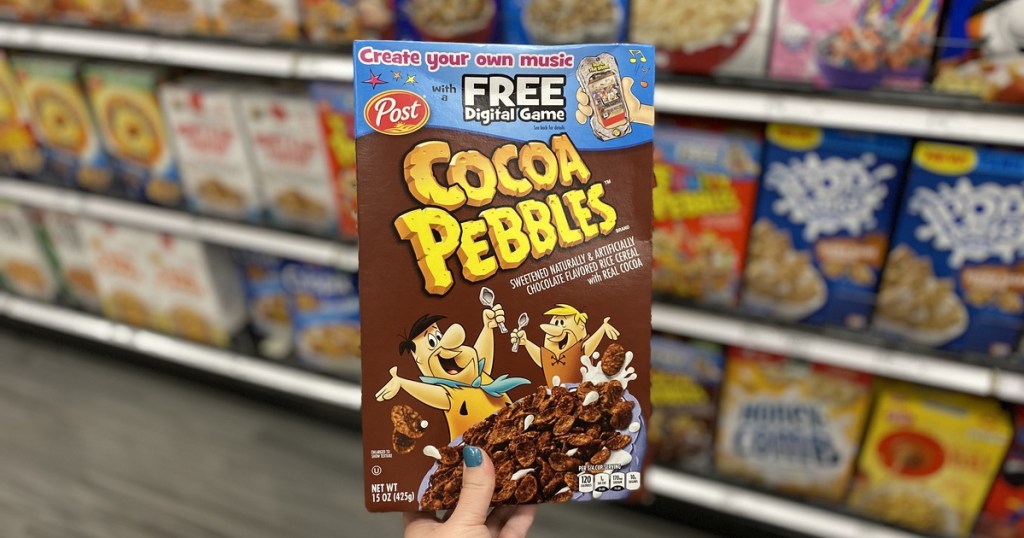 hand holding up box of cocoa pebbles at target