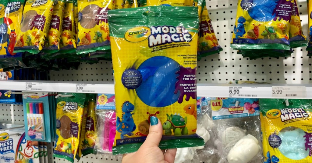 Crayola Model Magic 4oz in hand in front of target aisle