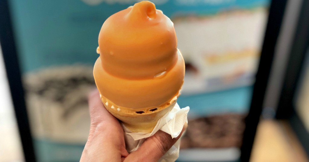 hand holding Dairy Queen Butterscotch cone