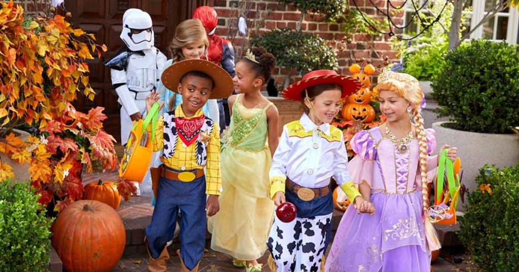 kids wearing various Disney halloween costumes