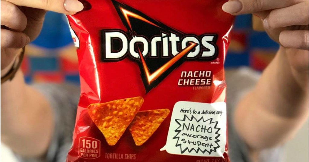 girl holding Doritos Nacho Chips Bag