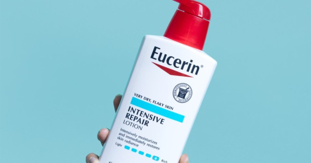 hand holding up Eucerin Intensive Repair Lotion 16.9 oz bottle
