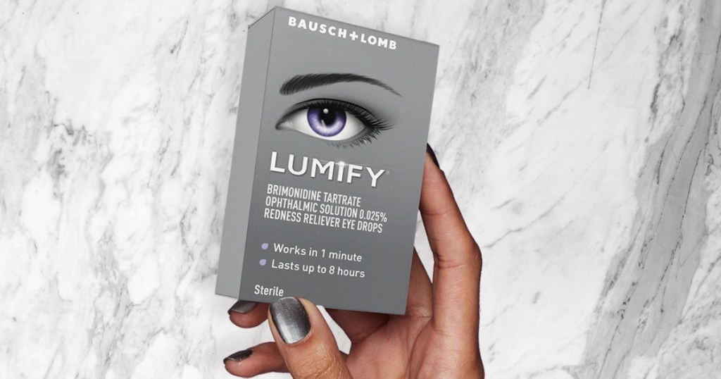 Bausch + Lomb free sample in hand over marble counter