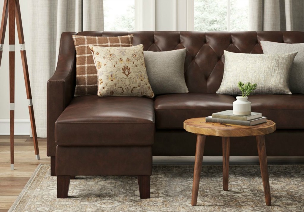 brown couch with throw pillows in a living room