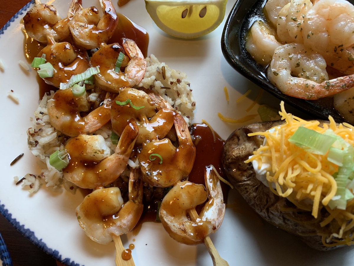 Skewers of Red Lobster's Teriyaki Grilled Shrimp on plate with rice