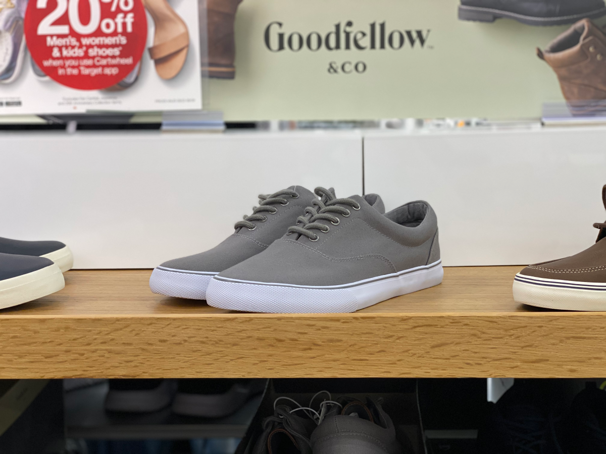 grey sneakers on store shelf with goodfellow & co sign behind them