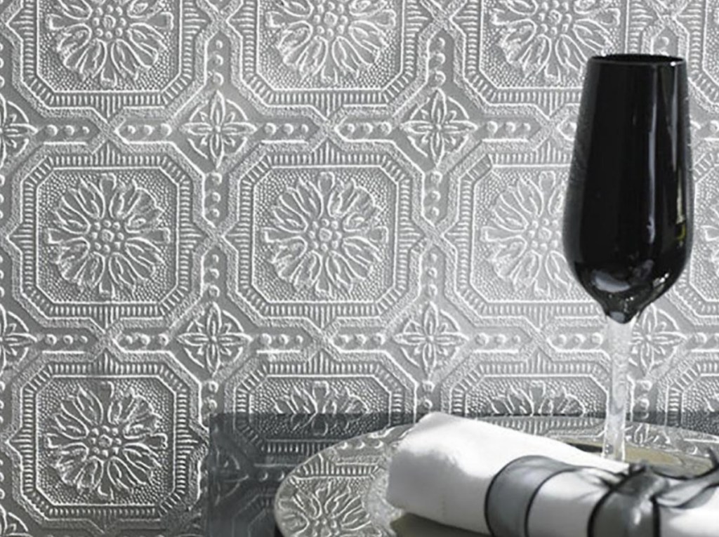 Paintable textured wallpaper with glass of wine on tray with napkins