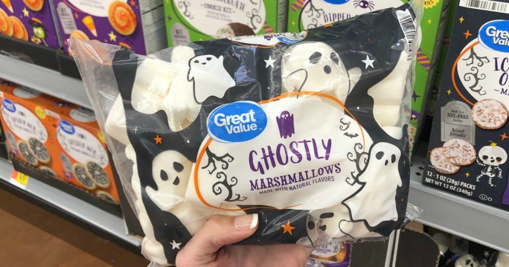 womanholding Great Value ghostly marshmallows in Walmart