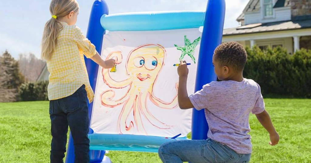 Kids painting on a HearthSong Giant Inflatable Easel