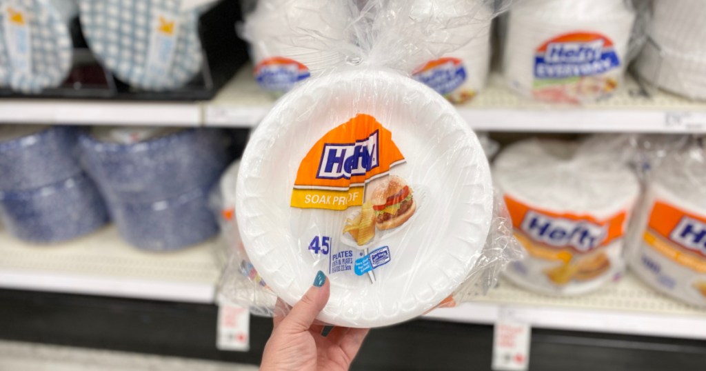 hand holding up pack of hefty plates