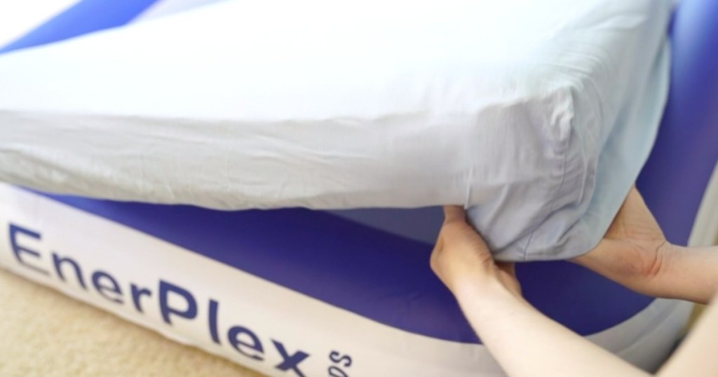 mom making an inflatable toddler bed