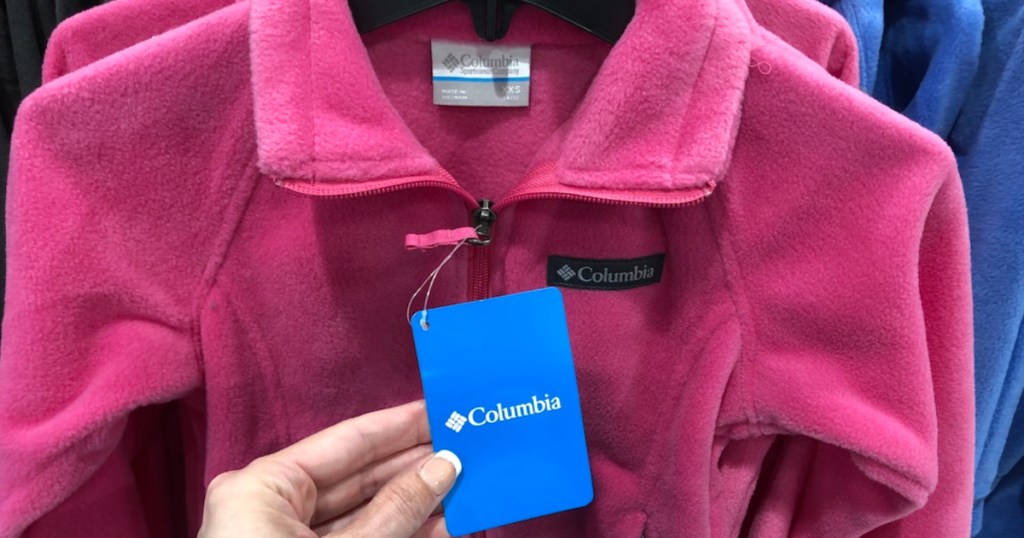 hand holding up columbia fleece jacket