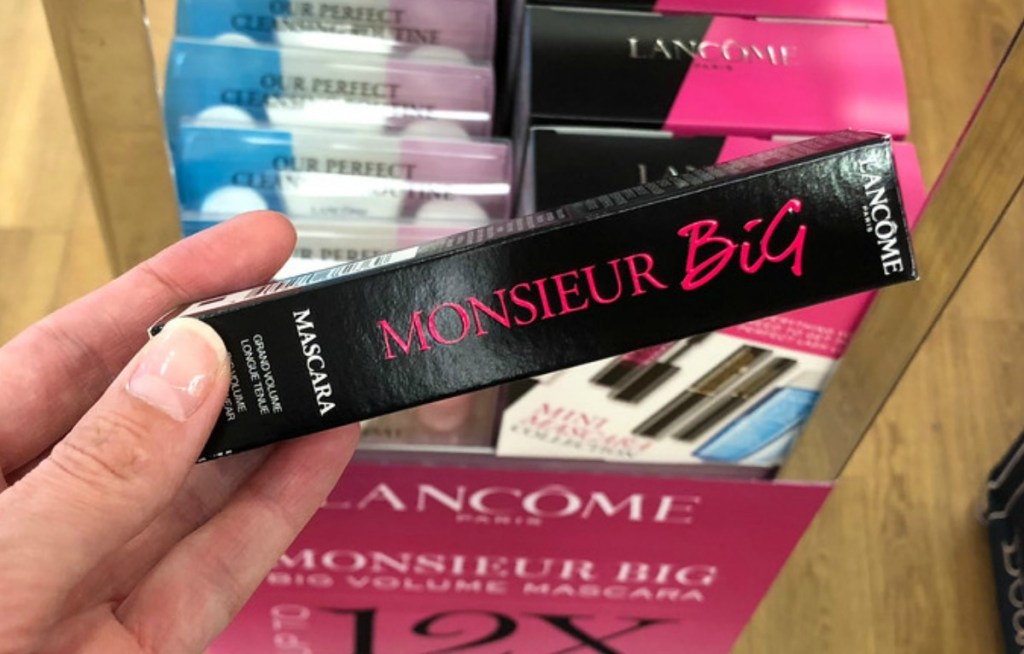 Lancome brand mascara in box in hand in-store
