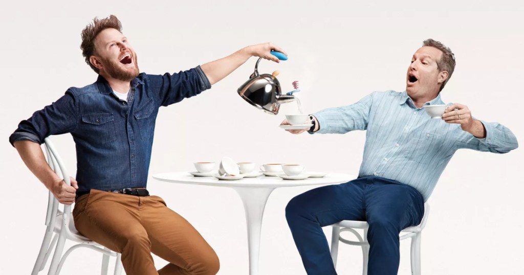 two men pouring tea from teapot