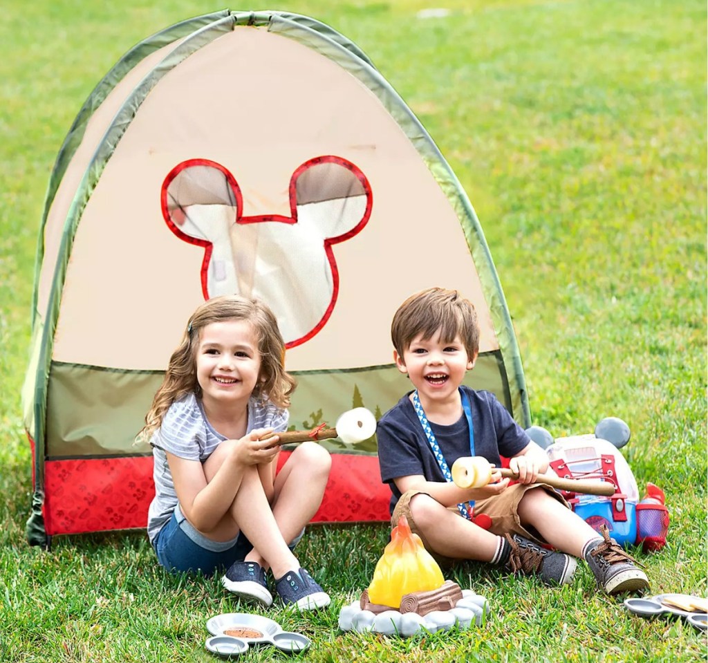 Mickey Mouse themed tent outside with kids