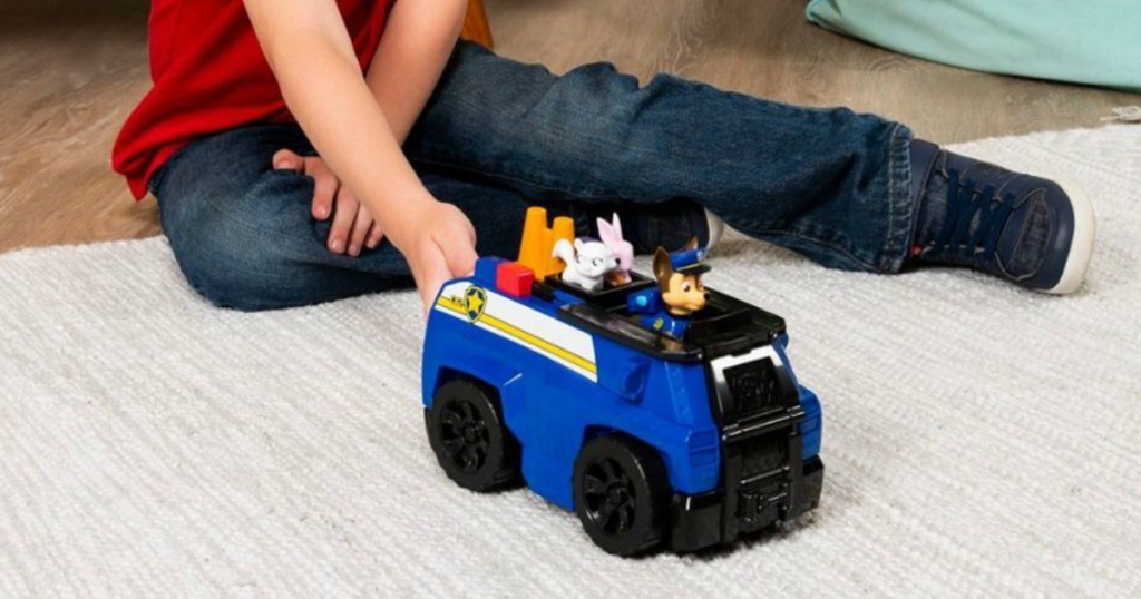 boy playing with Paw Patrol Rescue Vehicle