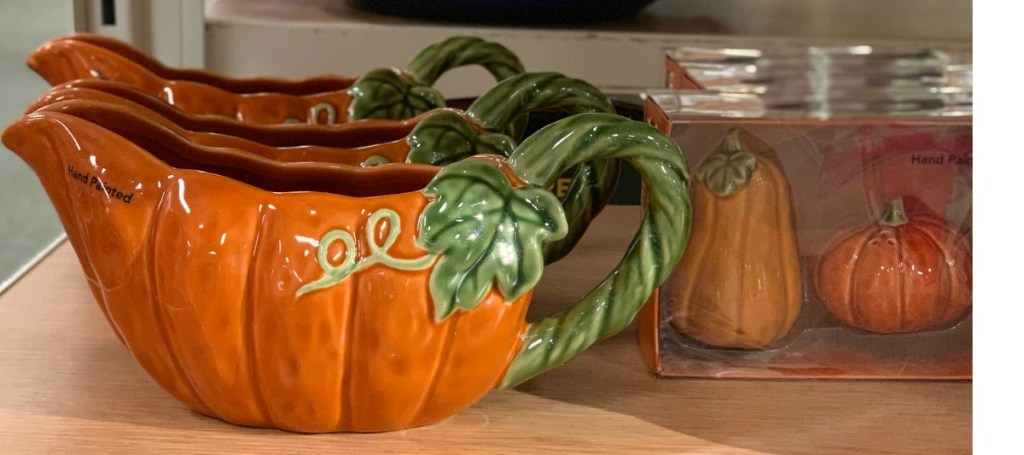 Pumpkin themed gravy boat and gourd themed salt and pepper shakers on display at store
