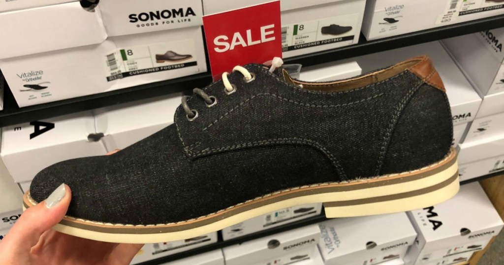 Woman holding SONOMA Goods for Life Warren Men's Oxford Shoes