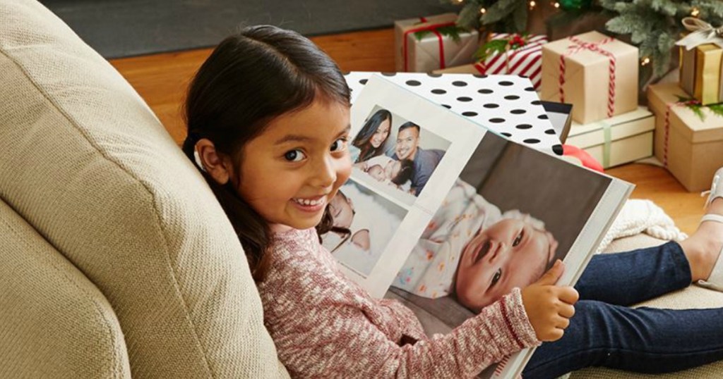 girl looking at Shutterfly Photo Book