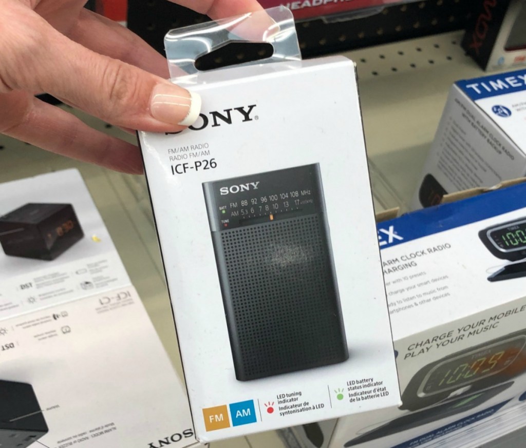 Portable Sony brand radio in hand at store in Walgreens on shelf