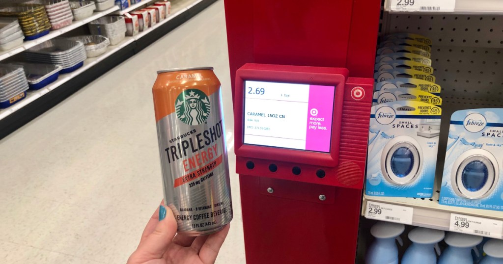 hand holding up can of starbucks tripleshot at target