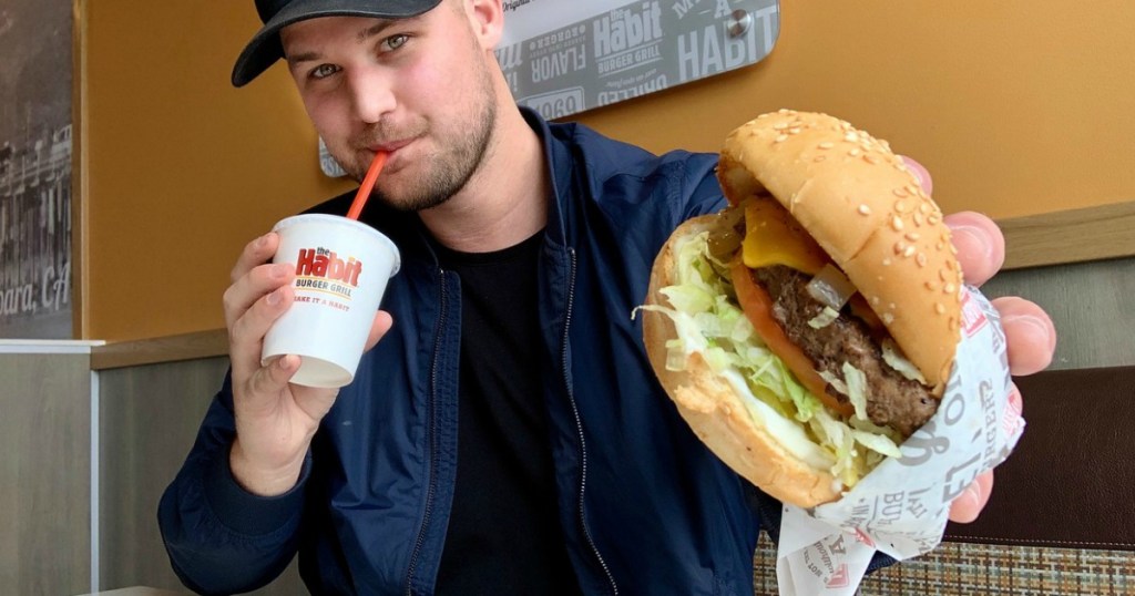 man holding a Habit Burger