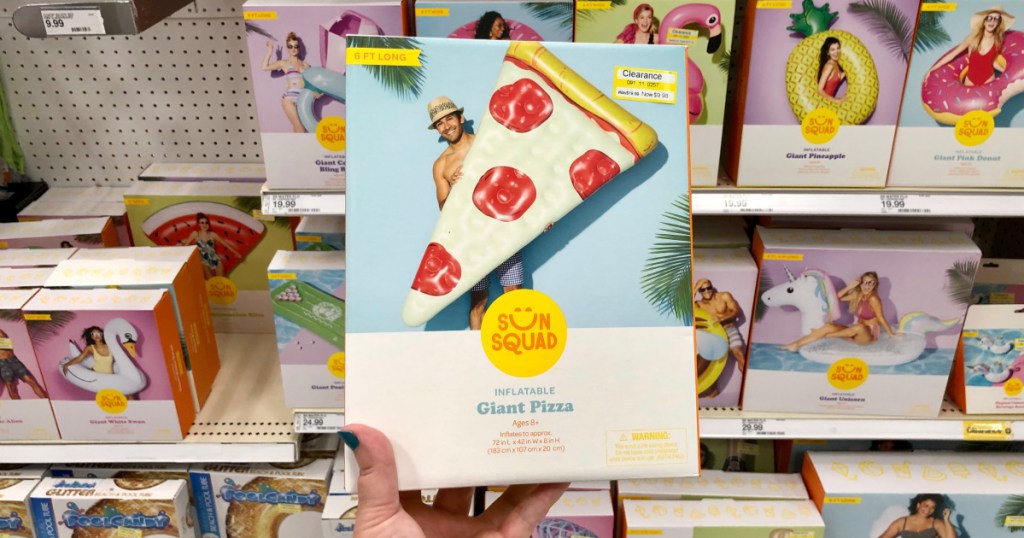 hand holding up sun squad pizza float box