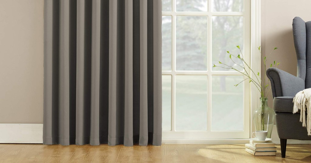 zun zero gray curtain panel hanging in living room
