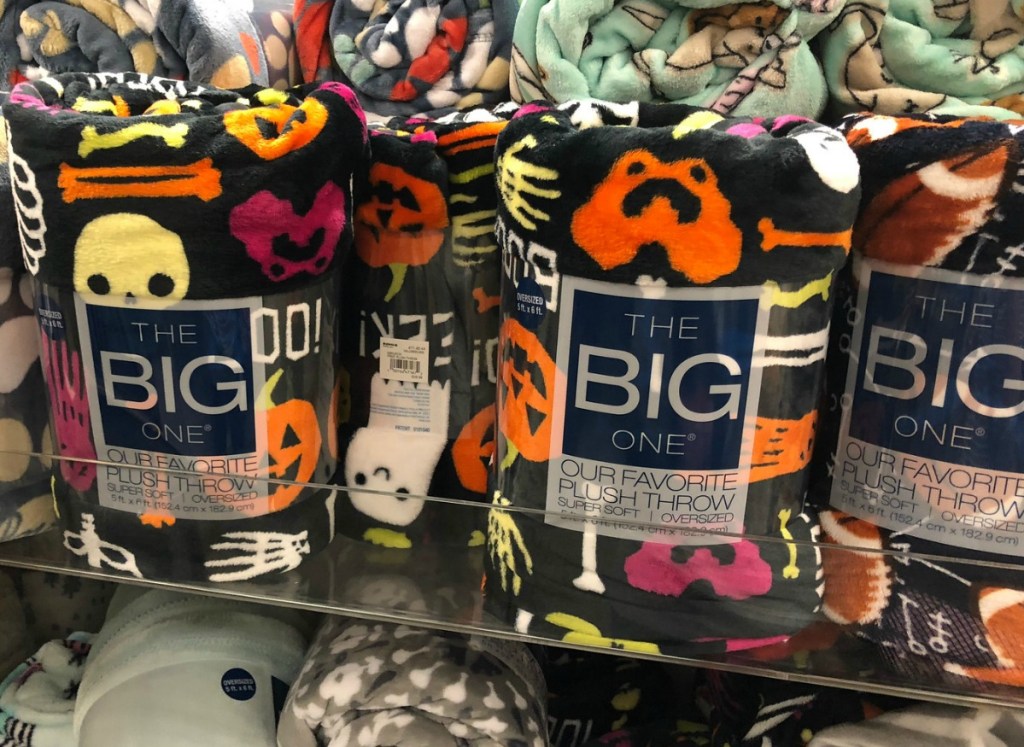 The Big One Plush Throws on display in Kohl's with Halloween print