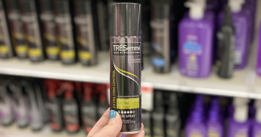 hand holding up tresemme hairspray at target