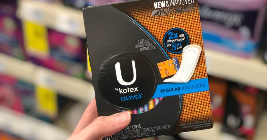 hand hoding box of u by kotex liners at store