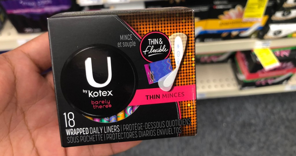 hand holding box of u by kotex liners at store