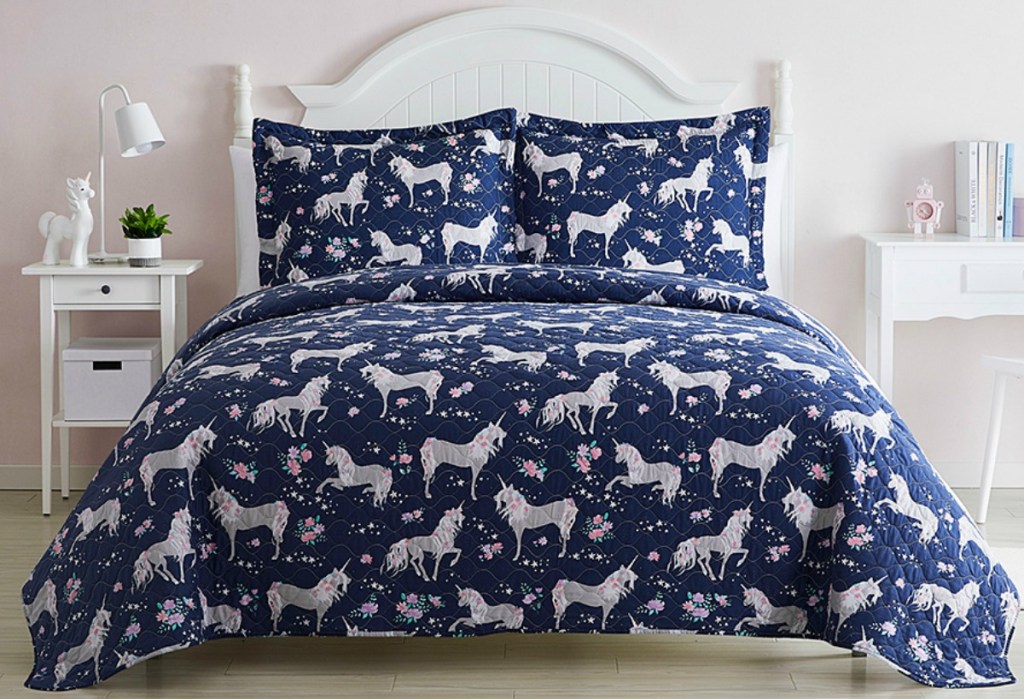 Navy Blue Quilt with Unicorn print on queen size bed